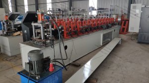Embossing roll up shutter slat roll forming machine